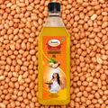 Sewari Cold Pressed Groundnut Oil. Shows peanuts in the background