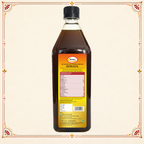 Sewari Cold Pressed Mustard Gold Oil. Shows 3 ingredients of the oil, mustard seeds, coriander seeds and lemon in the background